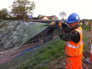 man watering Hydra CX