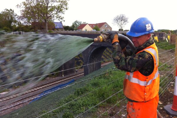 man watering Hydra CX